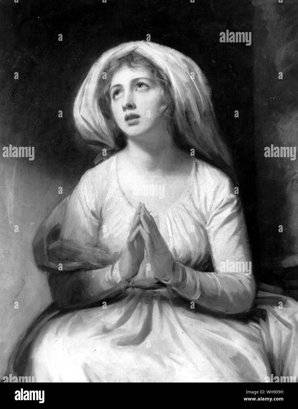 Emma at Prayer' by Romney. Romney often painted Emma Hamilton, posed with her face upturned to disguise her small receding chin, a feature she inherited from Mrs Cadogan.. Stock Photo