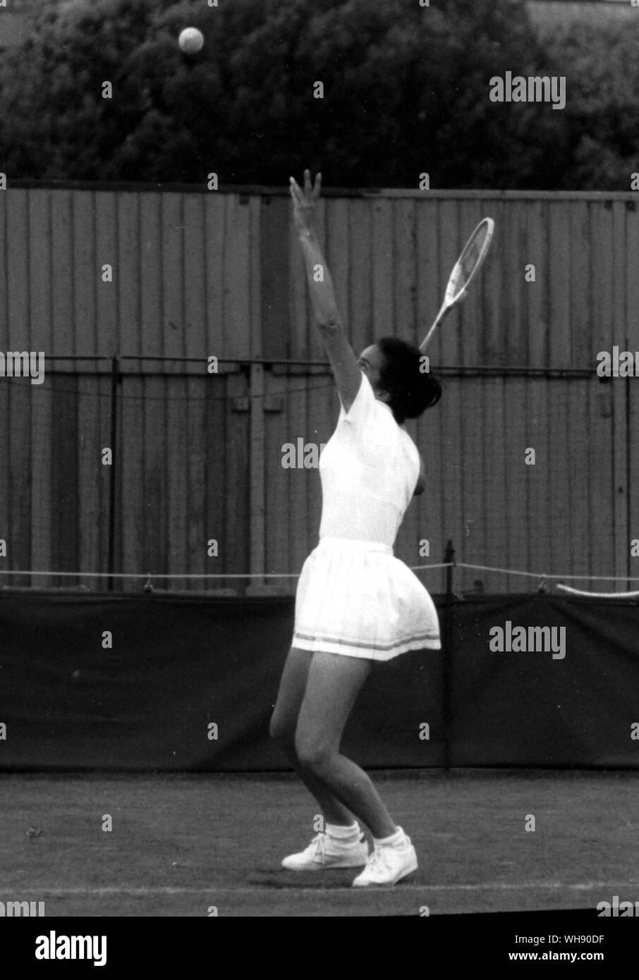 Virginia Wade serves the ball in a practice session.Virginia won Wimbledon in 1977.. Stock Photo