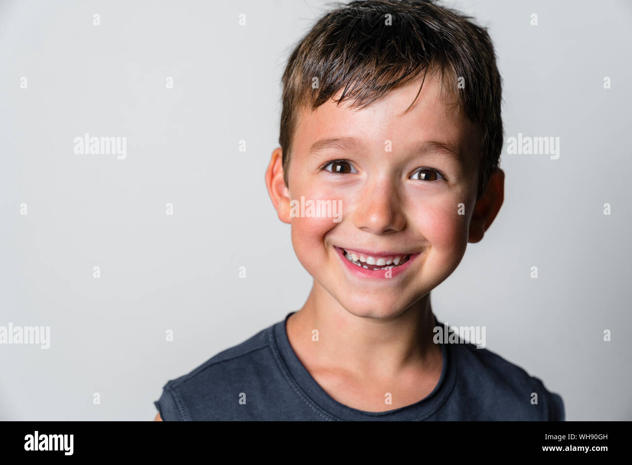 Portrait of strong boy, white background Stock Photo - Alamy