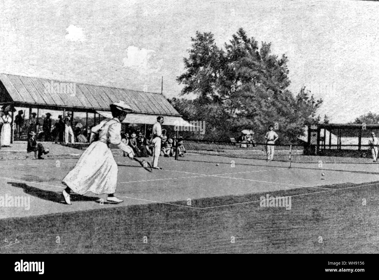 Mixed doubles at the Club de Dinard, a resort where lawn tennis was popular in its early days.. Stock Photo