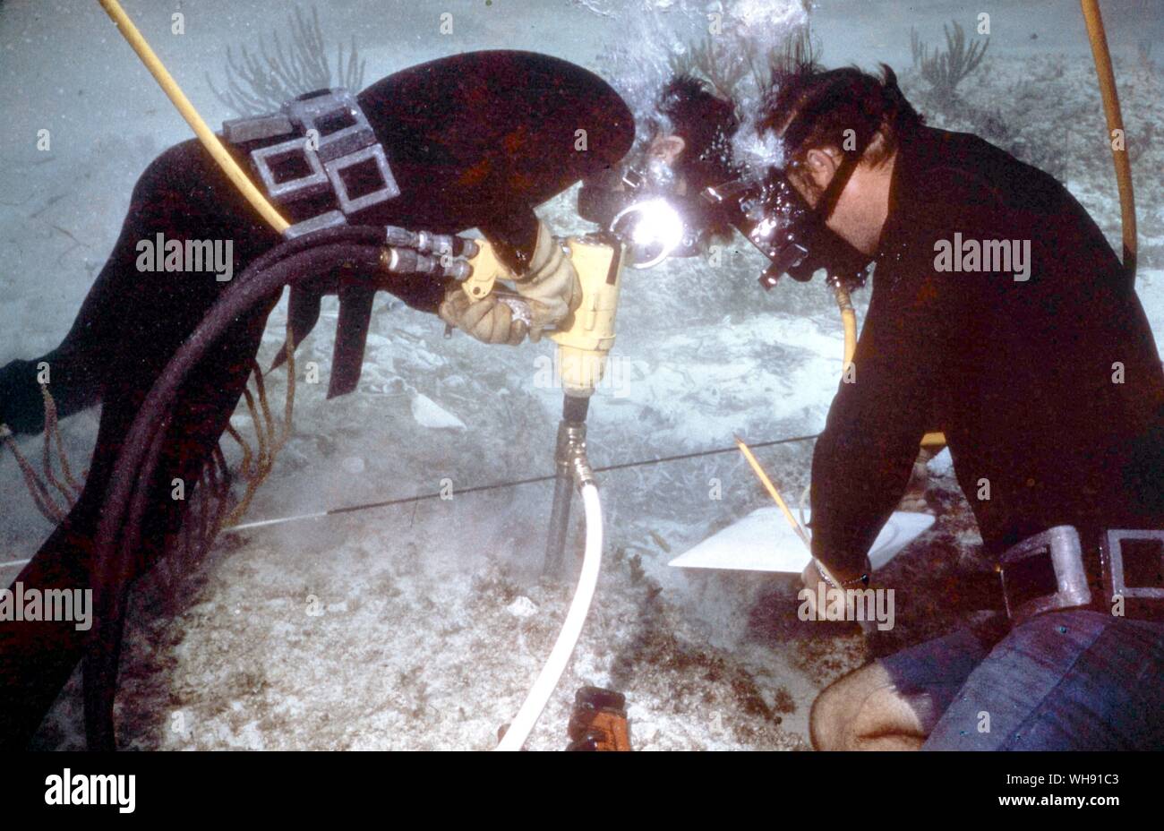 Undersea. Compressed air drill collecting geological samples. Stock Photo