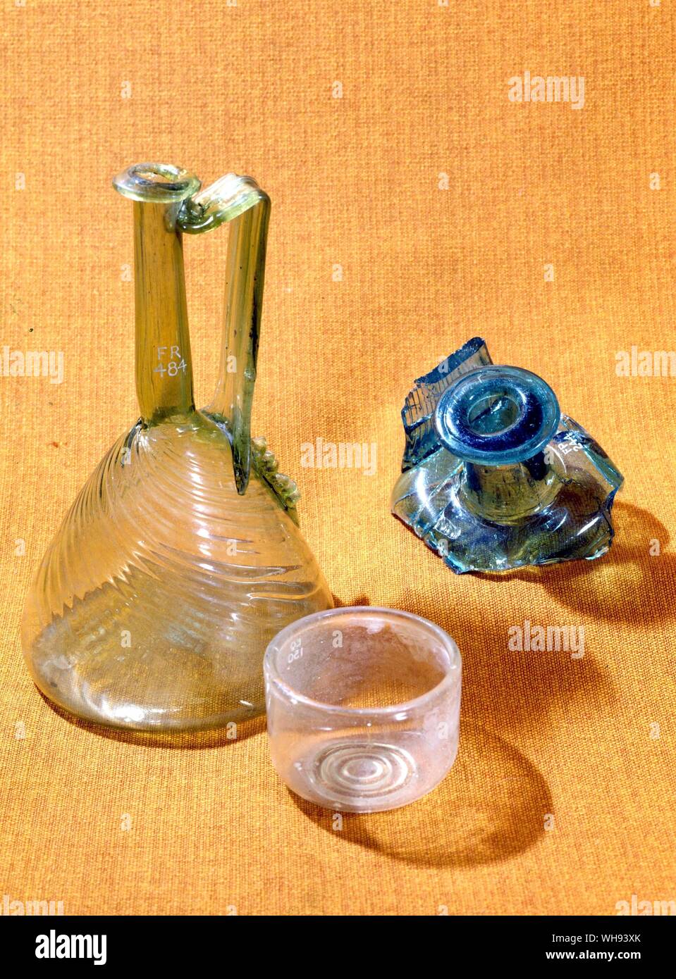 Relics of Roman Glass a jug found in Aberdeenshire, a bowl, the fagment of a bottle. Stock Photo