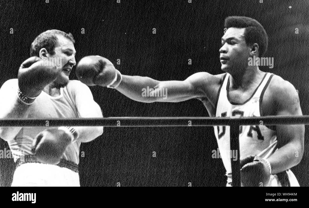 Mexico City Olympics 1968: George Foreman (r) of the USA lands a right hook on the chin of Russia's Iones Chepulis to win the gold medal.. Stock Photo