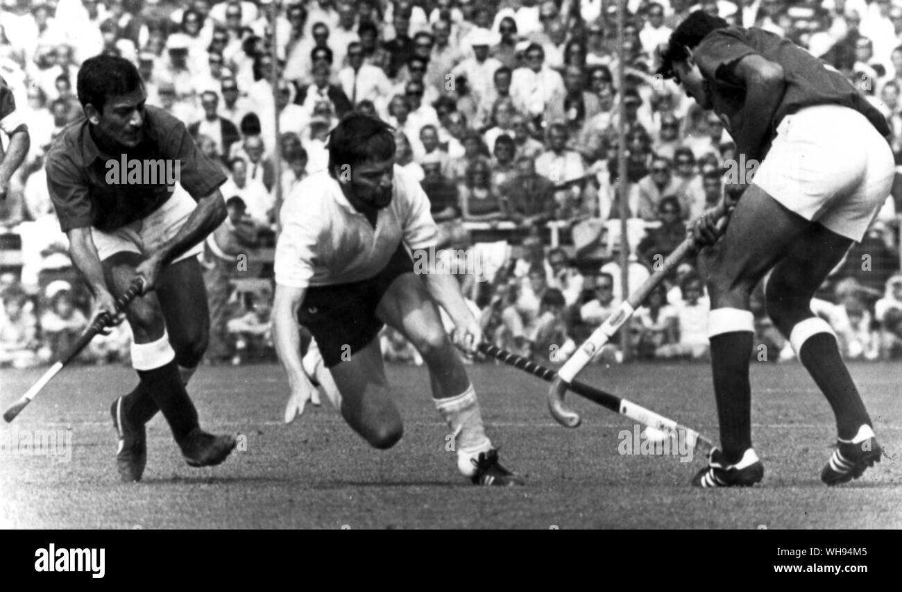 September 1972: Munich Olympics: Germany win the Men's hockey versus Pakistan in the final by 1-0. West Germany's Uli Vos, at centre, goes past Riaz Ahmed and Akhtarul Islam. Stock Photo