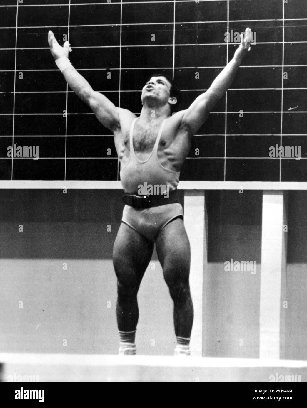 Mexico City Mini-Olympics 1967: M Nassiri, a bantam-weight weight-lifter from Iran, moments befoer his record-breaking lift of 145 kg. Stock Photo