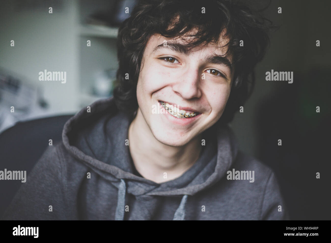 Portrait of smiling teenage boy wearing  braces Stock Photo