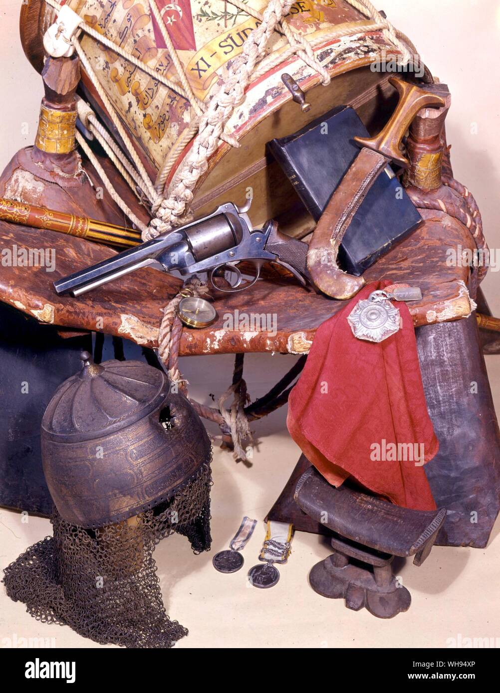 Some of Charles George Gordons belongings a drum belonging to the 11th Sudanese regiment, Gordon's camel saddle, compass, revolver, headrest and Bible, the Sultan of Darfur's helmet captured after his death in battle in 1879 medals struck by Gordon at Khartoum and those he won in Crimea Stock Photo