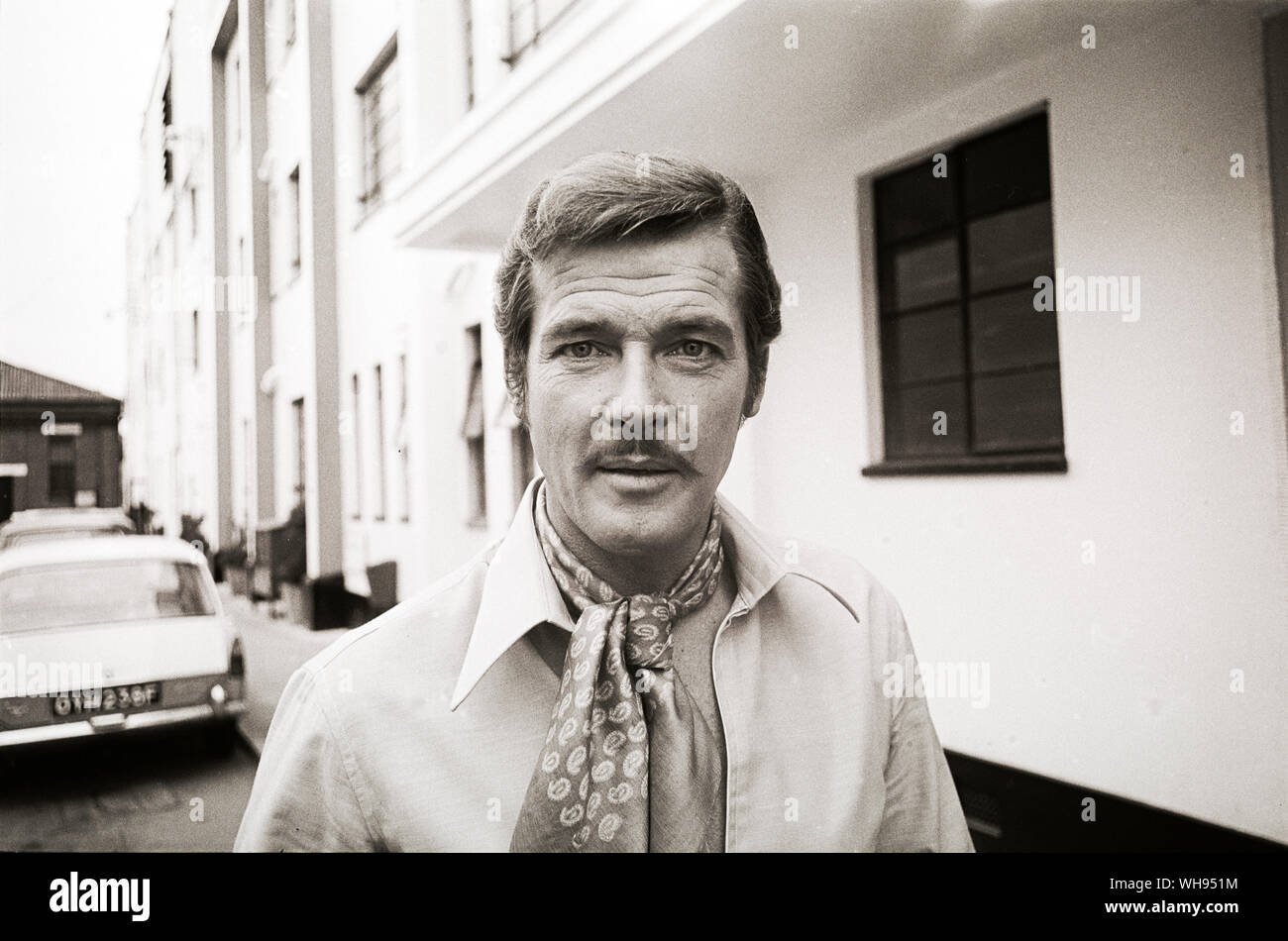 Actor Roger Moore outside Elstree studios outside London in 1969 when he was filming The Man Who Haunted Himselff Stock Photo