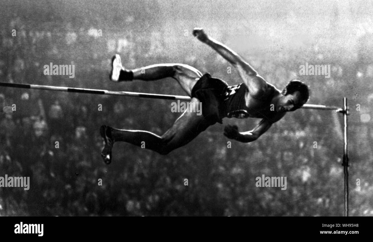 Japan, Tokyo Olympics, 1964: Valery Brumel (USSR) clears 7 feet, 1.75 (2.18m) inches to win the gold medal in the men's high jump.. Stock Photo