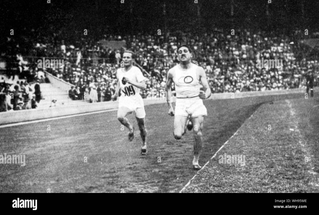 One of the most dramatic finishes of the games Hannes Kolehmainen (Finalnd) about to overtake Jean Bouin (France) in the last 30 metres of the 5,000 Metres finish at the Olympic Games Stockholm 1912 Stock Photo