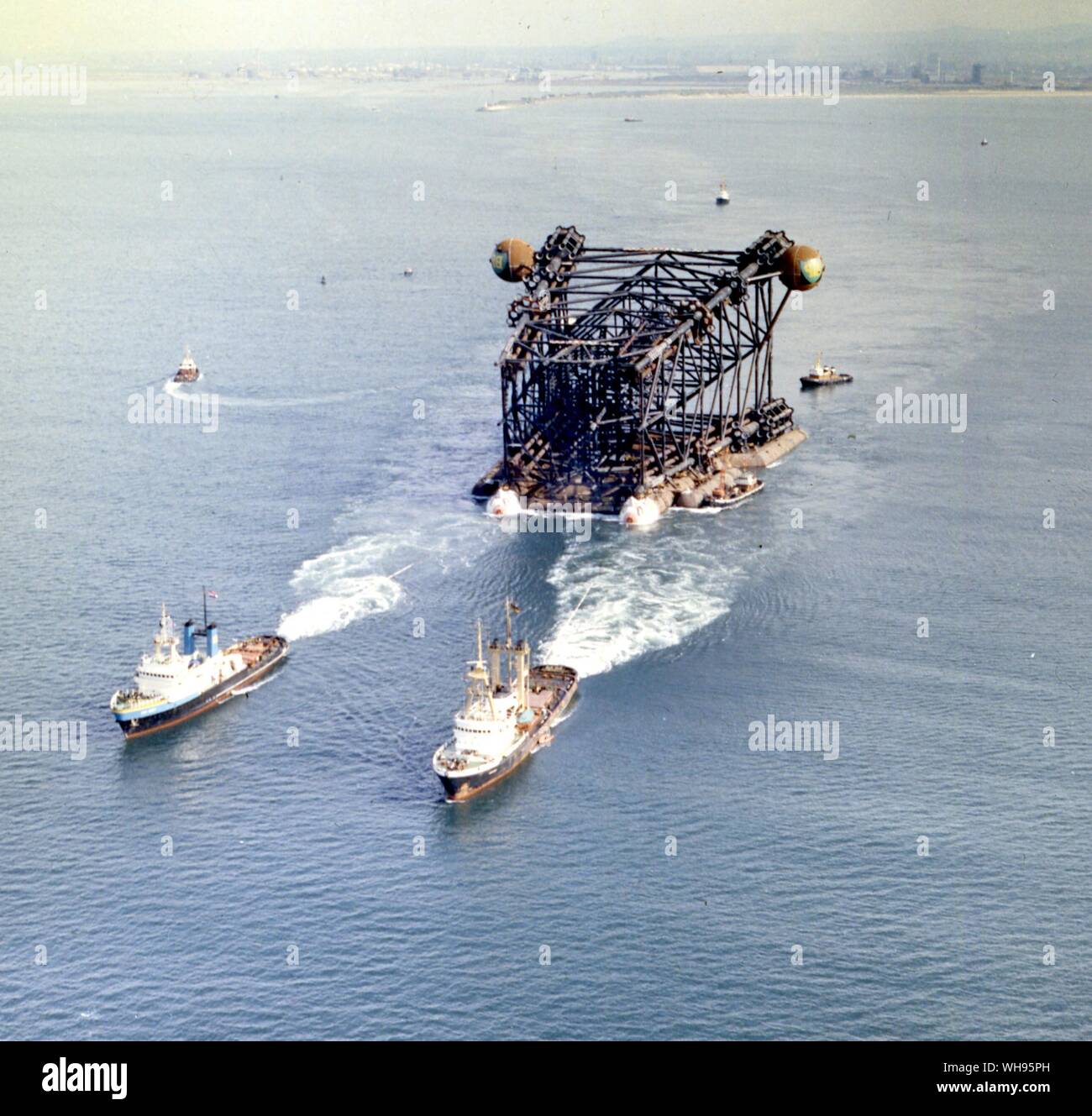 15th June 1975: 'Graythorp II' jacket section of production platform for BP's Forties oilfield in the North Sea, at the start of its tow from the construction dock at Graythorp, near Hartlepool to site.. Stock Photo