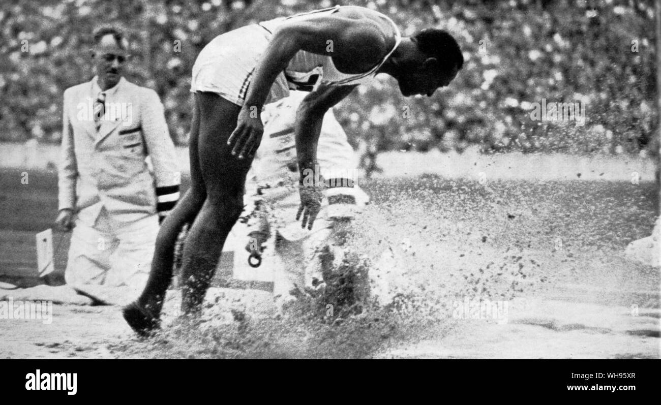 Jesse Owens winning the broad jump Olympic Games Berlin 1936 Stock