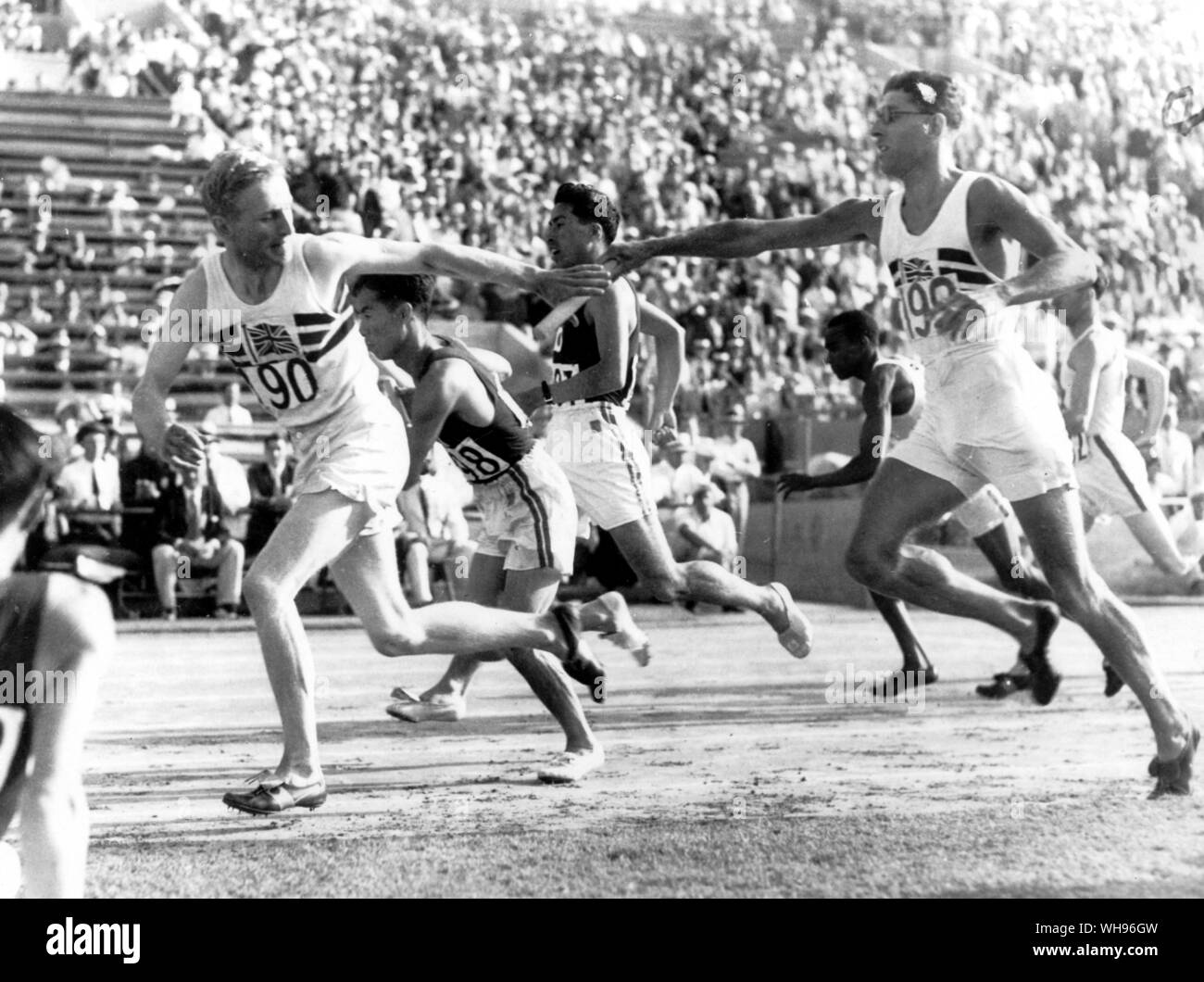 The Japanese and British teams are shown passing the baton in the 400 metre relay heats. Left to right Lord Burghley (Great Britain) Oki (Japan) Masuda (Japan) Thomas Hampson (Great Britain) Japan won the relay heat Olympic Games Los Angeles 1932 Stock Photo