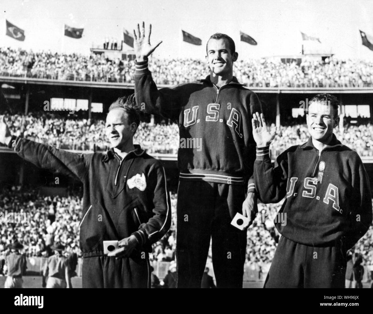 Aus., Melbourne, Olympics, 1956: Men's 100 metres winners' podium. l-r: 3rd, Hec Hogan . 1st, Bob Marrow . 2nd Walter Baker. Stock Photo