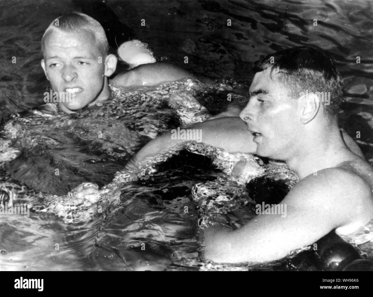 Italy, Rome, Olympic Games, 1960: John Devitt (Australia, right) and Lance Larson (USA) are shown in the olympic pool after there neck and neck 100m final race. The judges gave the title to Devitt, but both were acredited with the time of 55.2 seconds, an olympic record.. Stock Photo