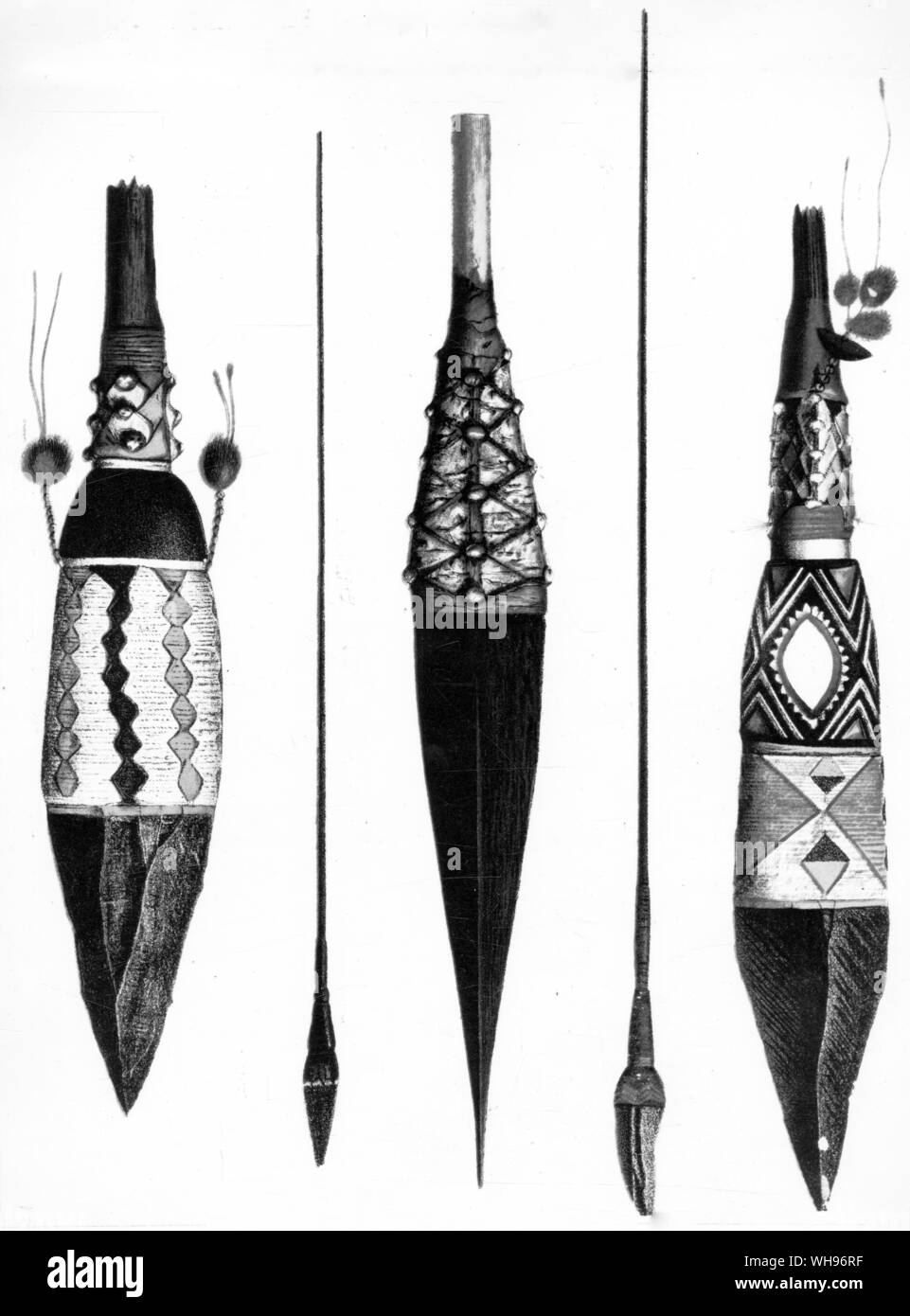 New Guinea: Admiralty Islands. Spears. The central one below has its tip, made of hardwood, painted to look like the obsidian heads to the left and right. Stock Photo