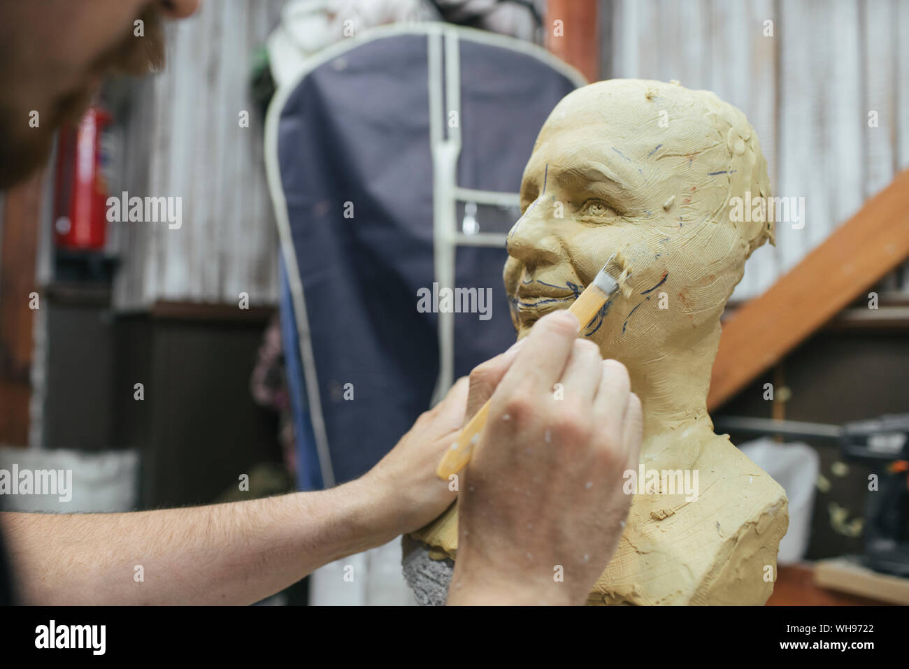Sculptor working on a bust Stock Photo - Alamy