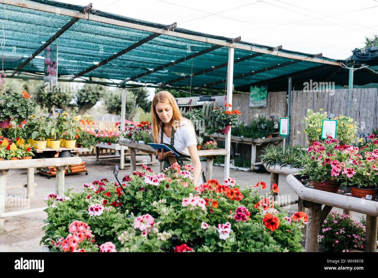 Caring female worker holding hi-res stock photography and images - Alamy