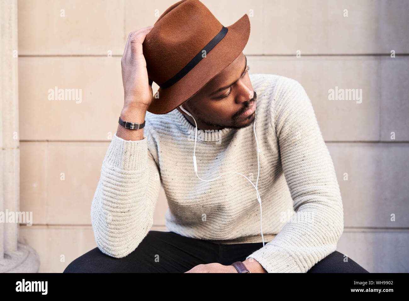 Portrait of mid adult man wearing brown hat Stock Photo