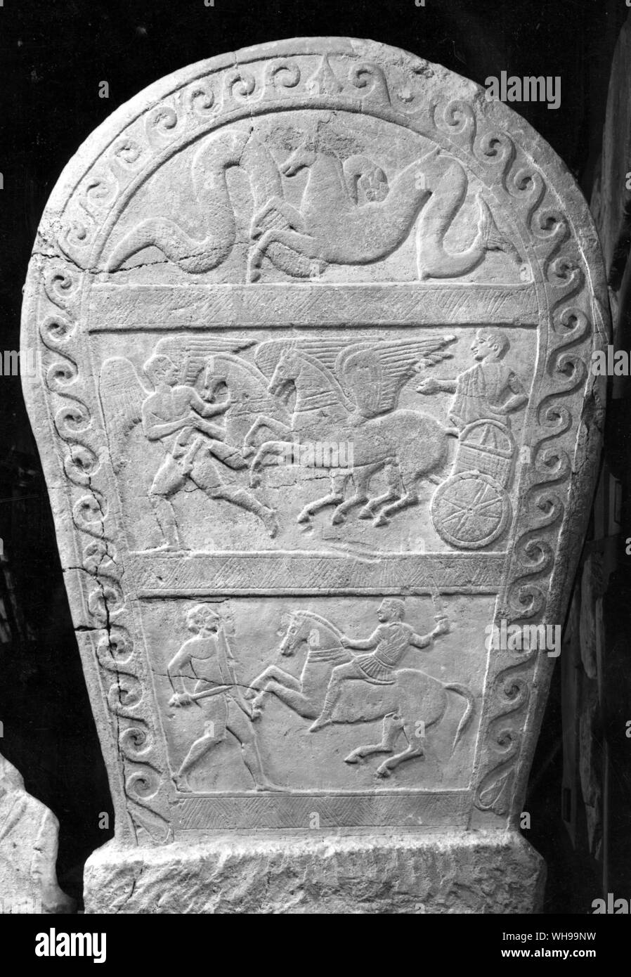A plaque showing the deceased riding through the Underworld in a chariot. the scene below represents him as a cavalryman fighting a gaul on foot Stock Photo