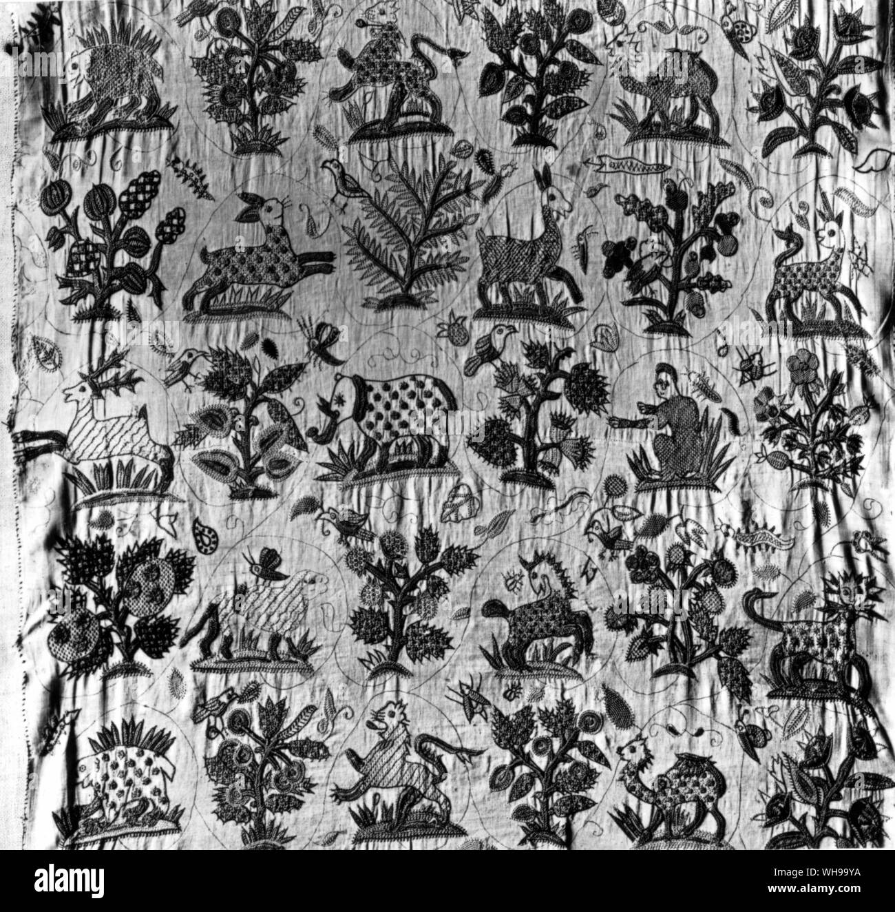 English needlework bedcover in coloured silks on satin. c.1690.  Not only individual motifs, but the overall pattern is influenced by chintz, Stock Photo