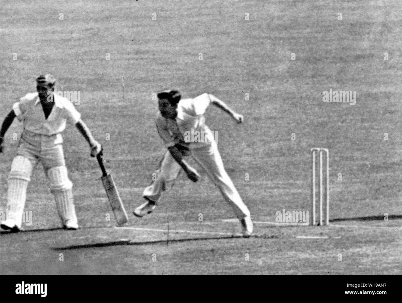 Douglas V P Wright bowling for England against New Zealand at the Oval in 1949. B Sutcliffe is the batsman and J S Lee the Umpire at the bowler end Stock Photo