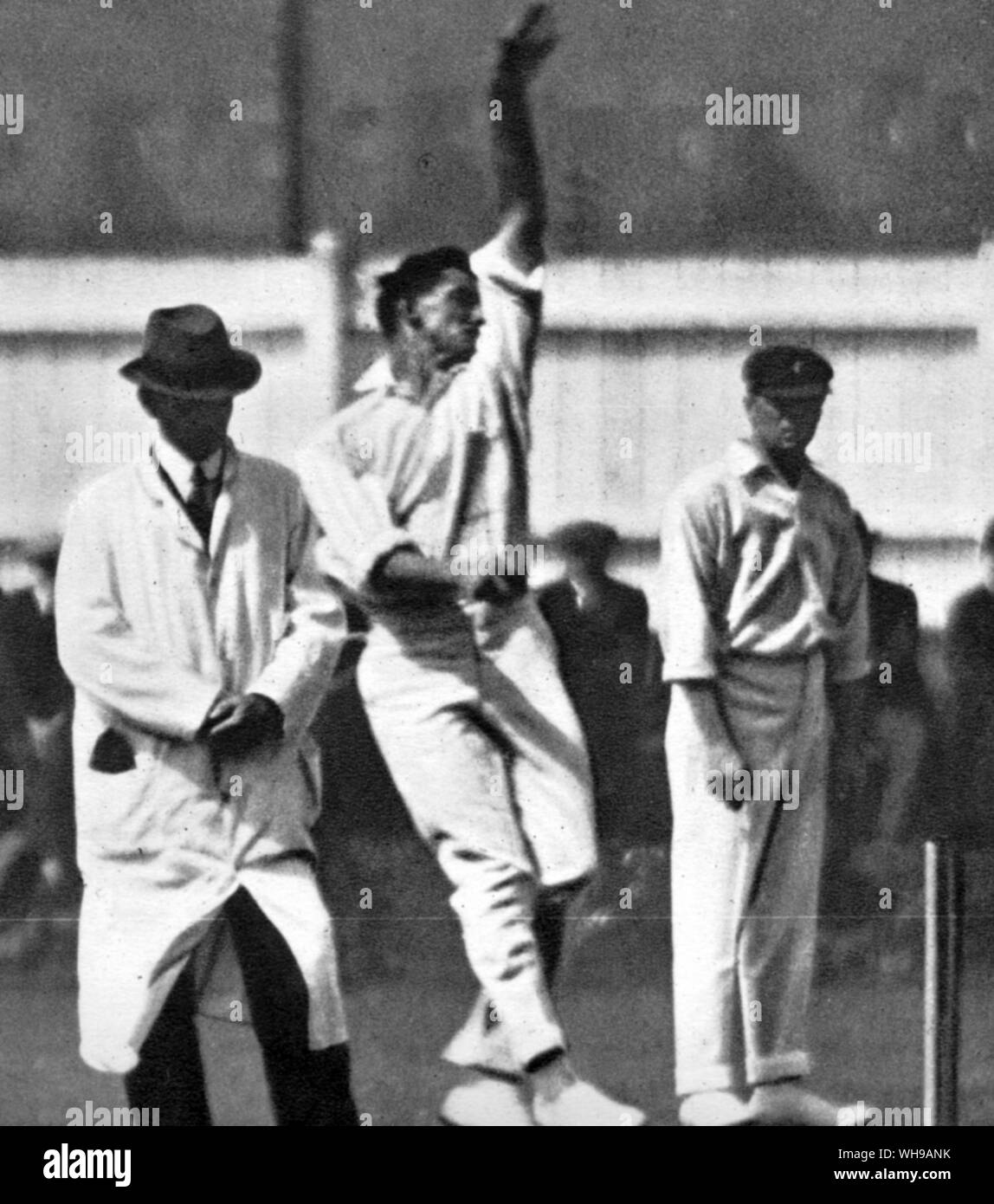 (Ted) E A McDonald 1892-1937 bowling against Leicester at the start of 1921 Australian tour. W Bardsley is at mid field Stock Photo