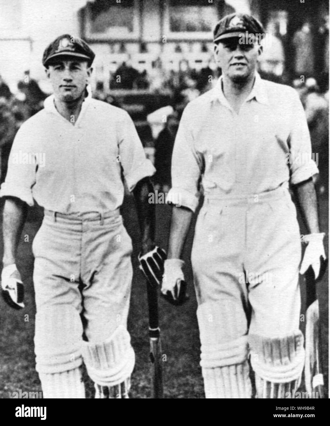 William Maldon  Woodfull born 1897 with  Don Bradman going out to bat Stock Photo