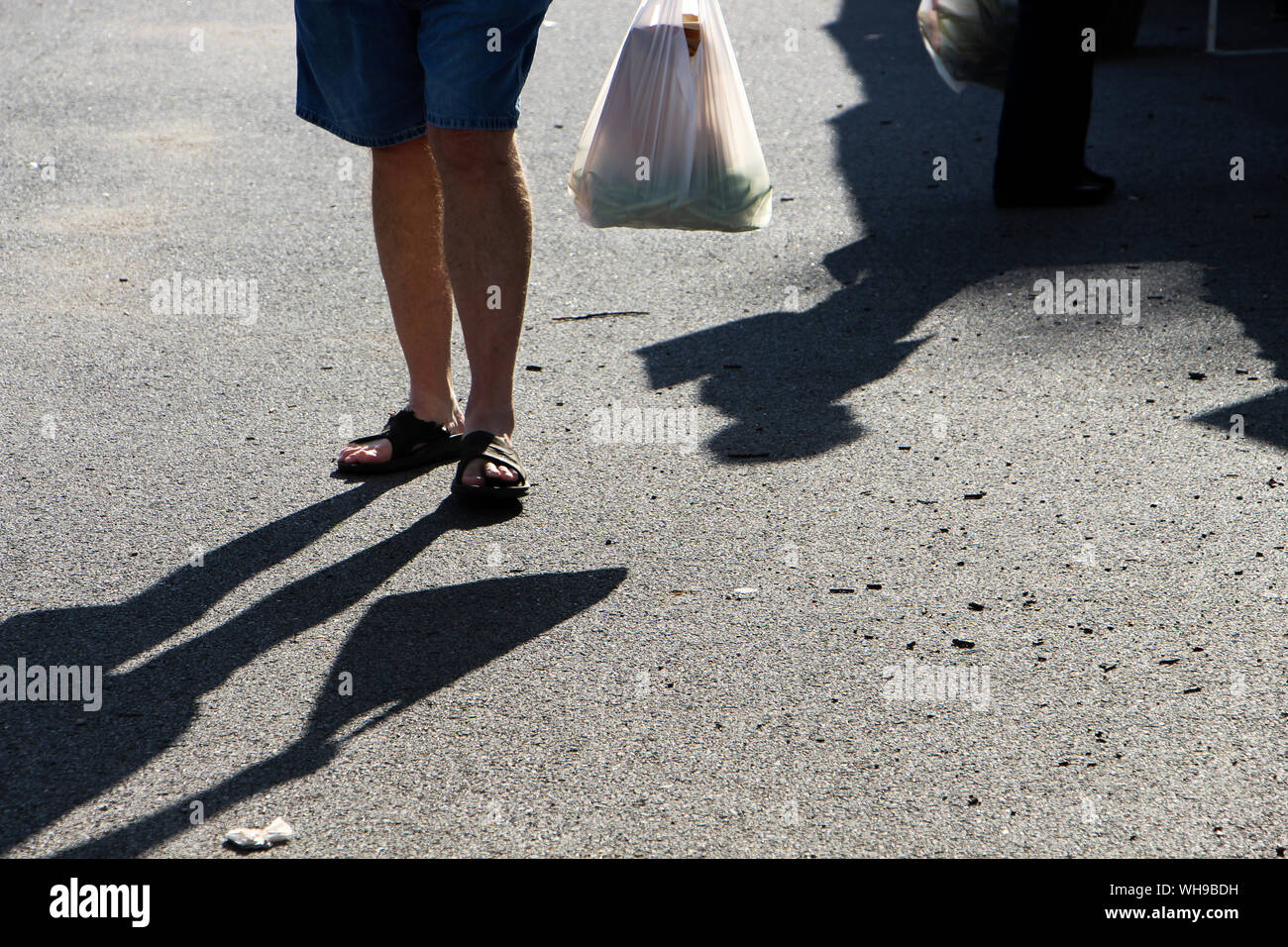 Plastic bag man hires stock photography and images Alamy