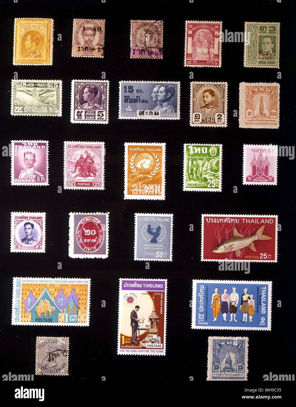 ASIA - THAILAND: (left to right) 1. 1 salung, 1883, 2. 1 att, 1894, 3. 10 atts, 1902, 4. 5 atts, 1905, 5. 3 satangs, 1918, 6. 5 satangs, 1925, 7. 5 satangs, 1928, 8. 15 satangs, 1932, 9. 2 satangs, 1941, 10. 2 satangs, 1943, 11. 5 satangs, 1951, 12. 25 satangs, 1955, 13. 25 satangs, 1957, 14. 25 satangs, 1960, 15. 50 satangs, 1962, 16.2 bahts, 1963, 17. 20 satangs, 1963, 17. 20 satangs, 1963, 18. 50 satangs, 1964, 19. 25 satangs, 1968, 20. 1 baht, 1970, 21. 1 baht, 1970, 22. 2 bahts, 1971, 23. British Post Office in Bangkok, 10 cents, 1882 Stock Photo