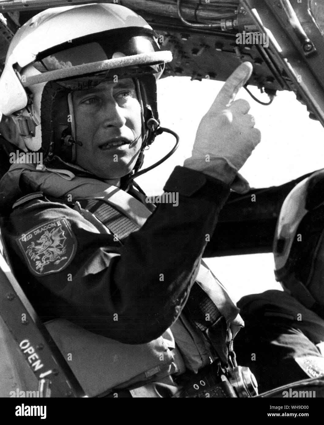 September 1974: Prince Charles, son of Queen Elizabeth of Great Britain and Northern Ireland. Naval Lieutenanrt Charles reconnoitres the controls before going up for his first dual control flying lesson in a Royal Naval Wessex V helicopter at a Royal Navy Air Station in Yeovilton. Stock Photo