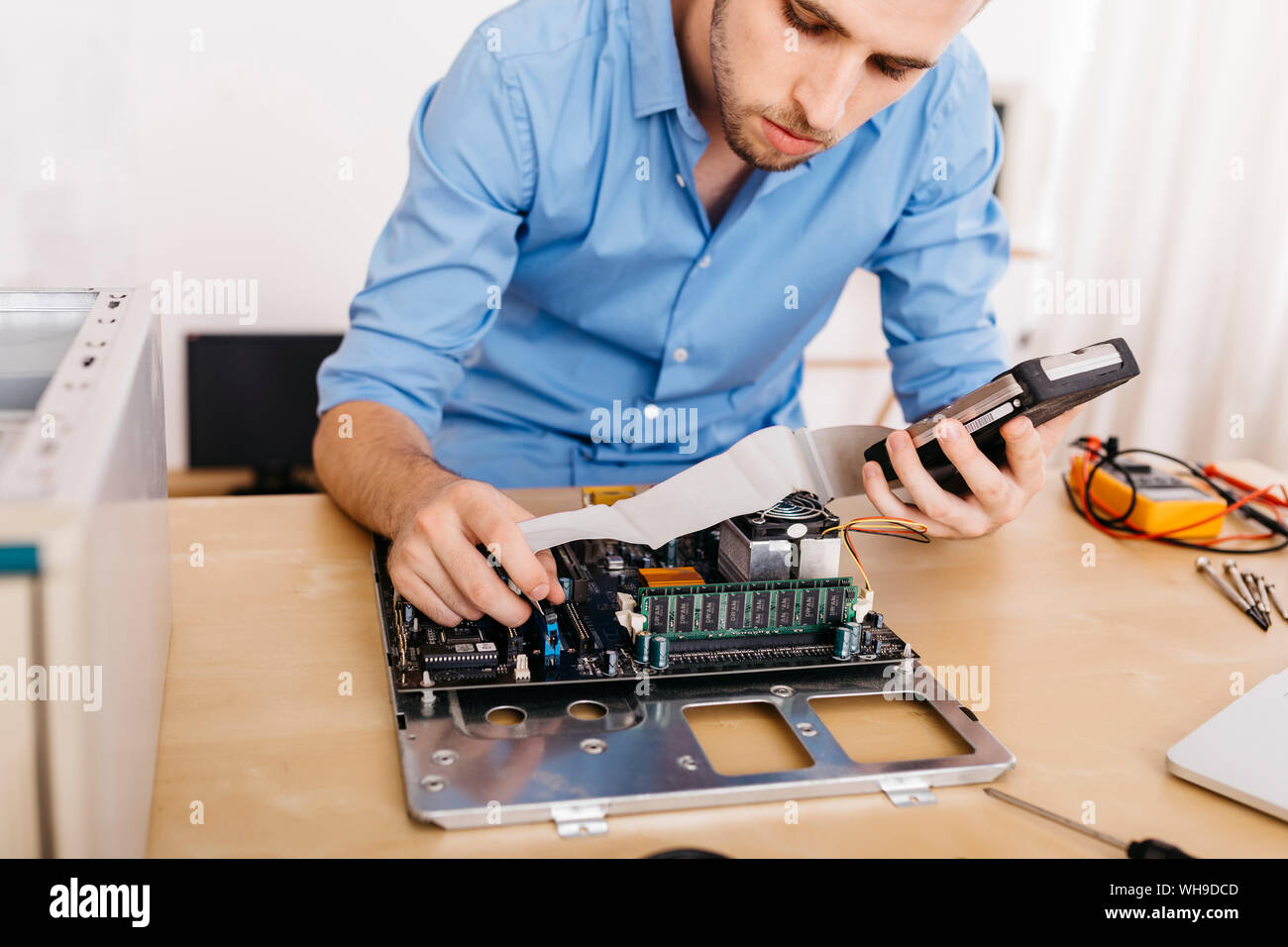 Technician repairing a desktop computer Stock Photo