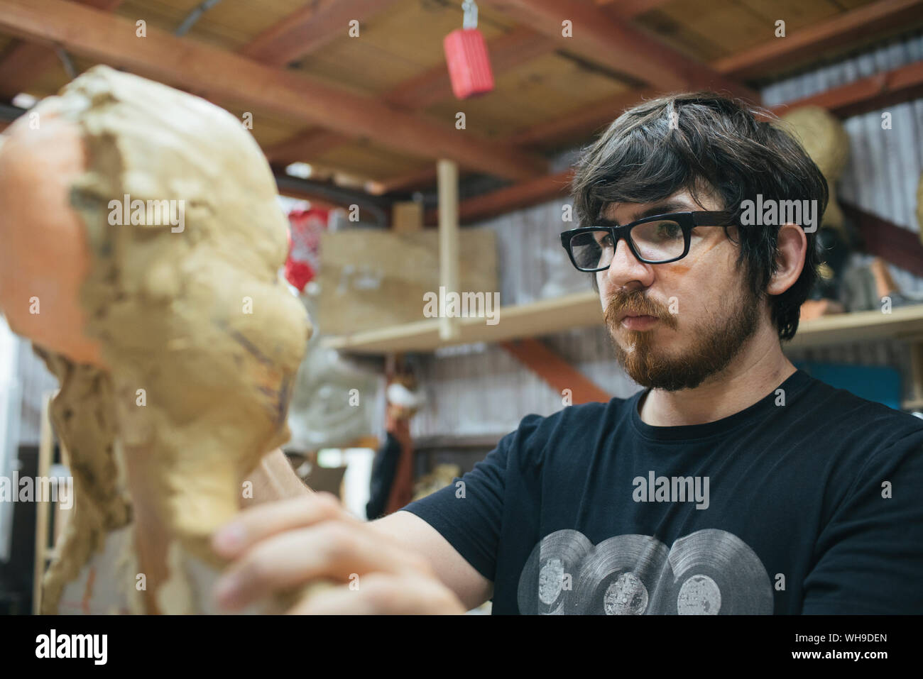 Sculptor working on a bust Stock Photo - Alamy