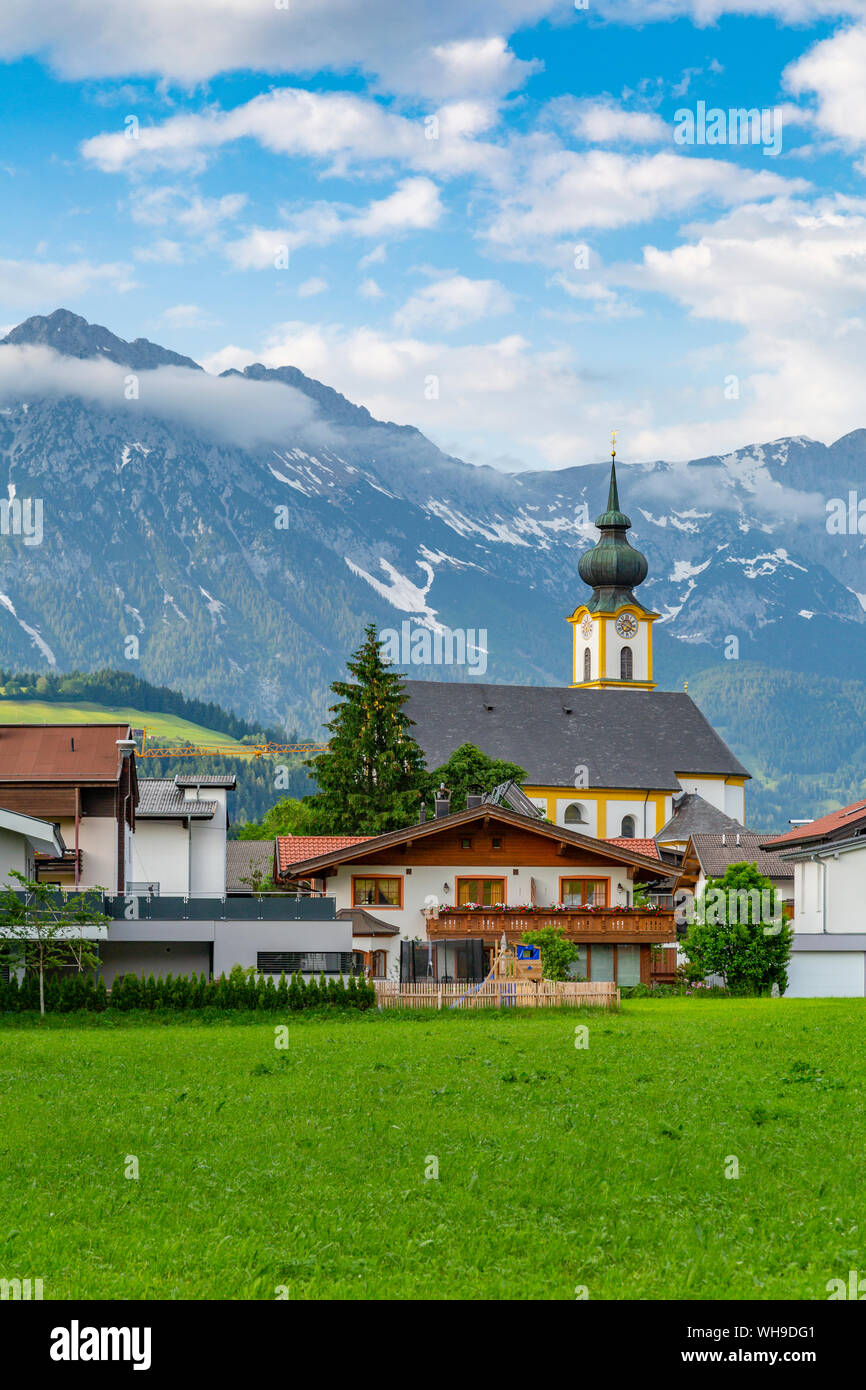 View of Pfarramt Soll Church and mountains in background, Soll, Solllandl, Tyrol, Austria, Europe Stock Photo