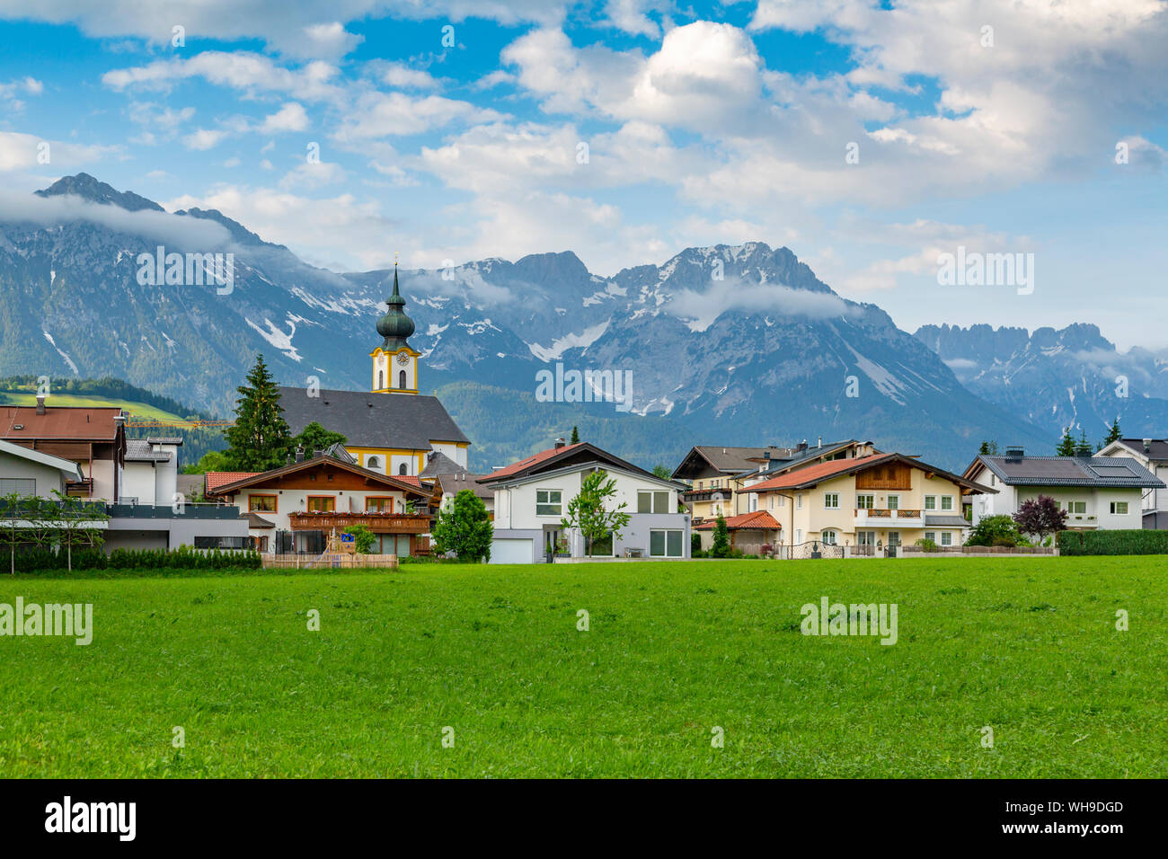 View of Pfarramt Soll Church and mountains in background, Soll, Solllandl, Tyrol, Austria, Europe Stock Photo