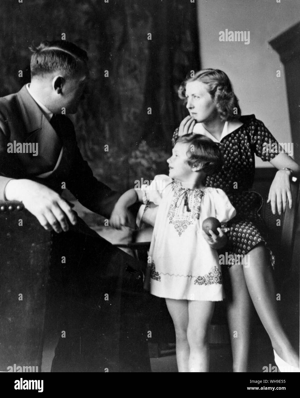 Adolf Hitler and Eva Braun with a little girl from a photo album belonging to Eva Braun. Stock Photo