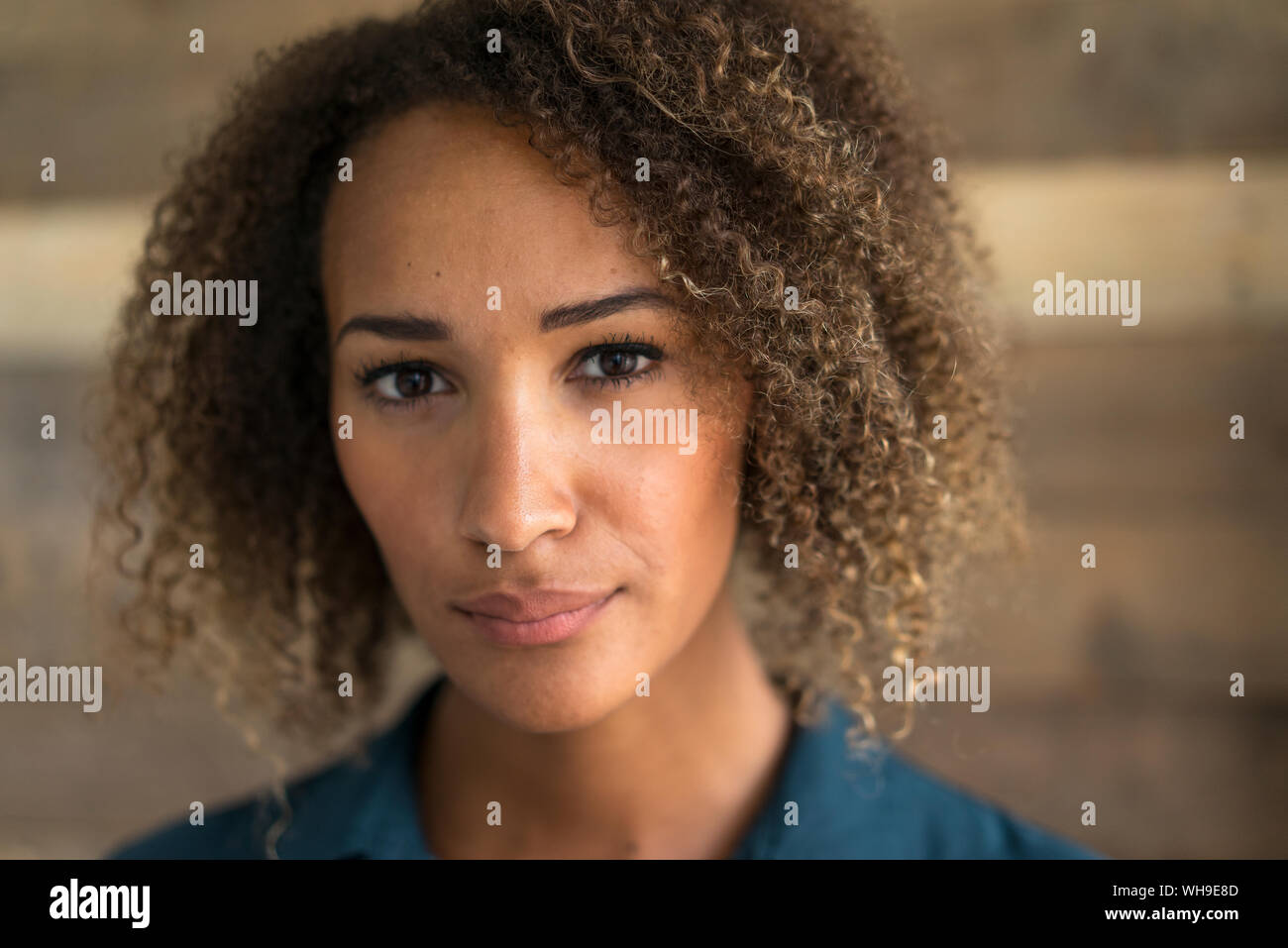 Portrait of young woman with ringlets Stock Photo