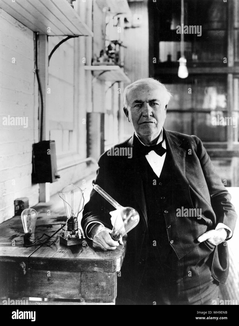 Thomas A Edison (1847-1931), US scientist and inventor, with over 1000 patents. In 1889 he formed the Edison Light Company. He stands here with some of his Edison Effect lamps. Stock Photo