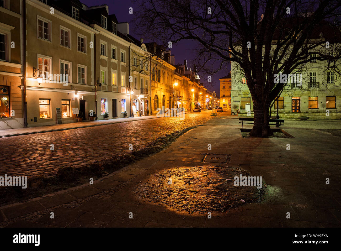 Houses along atmospheric Freta Street at New Town Square at night, Warsaw, Poland Stock Photo