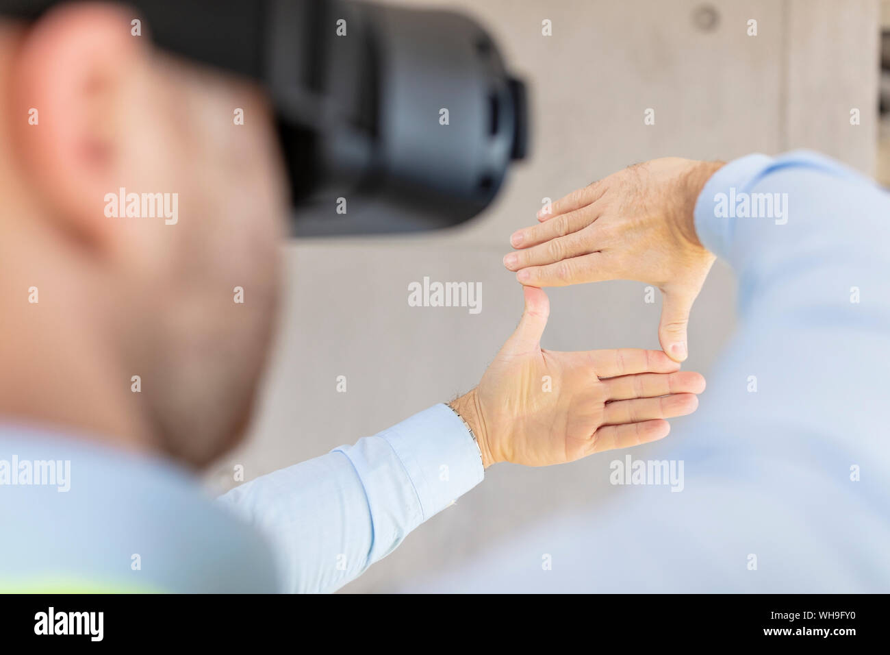 Architect with VR glasses at construction site Stock Photo