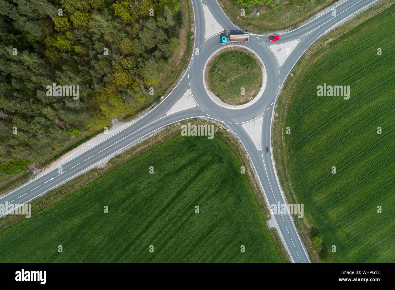 Aerial view of roundabout intersection with traffic. Franconia, Bavaria