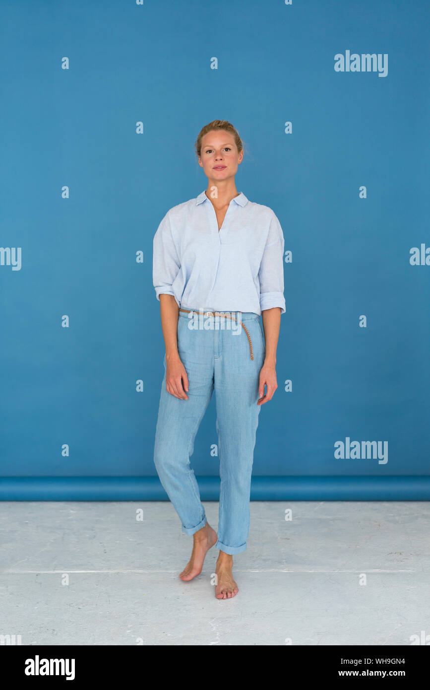 Attractive woman in blue hi-res stock photography and images - Alamy