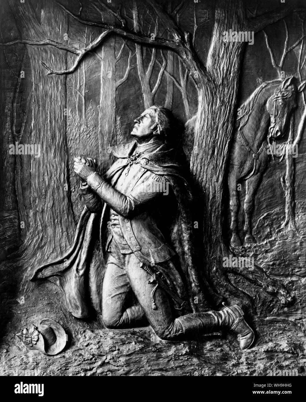 George Washington (1732-1799), 1st President of the USA praying at Valley Forge. Bas-relief by Kelly, 1907. Stock Photo