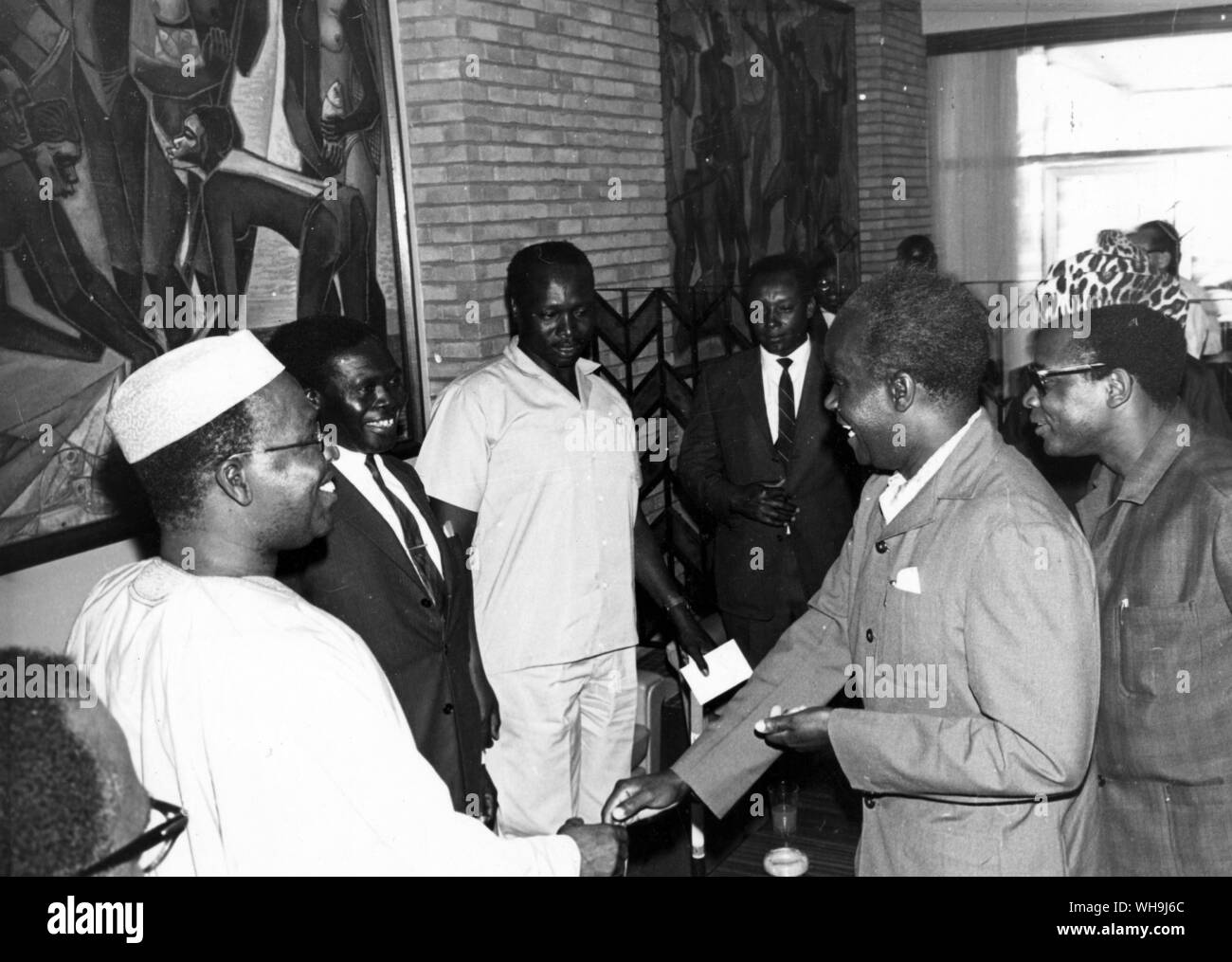 10th September 1967: Zambia President Kenneth Kaunda (2nd right) shakes hands with three heads of state in Kinshas's airport as he arrived to participate in the O.A.U summit conference. l-r: Obafemi Awonowo, Vice-President of the Federal Executive Council of Nigeria: Dr. Milton Obote of Uganda; Kenya Vice-President Arap Mai (dressed in white). Behind Kaunda is Congo President, General Mobutu. Stock Photo