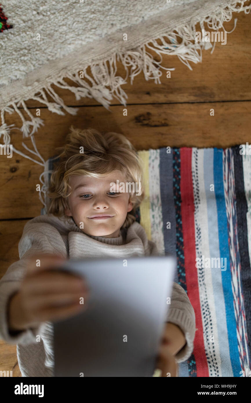 Children lying on top hi-res stock photography and images - Alamy