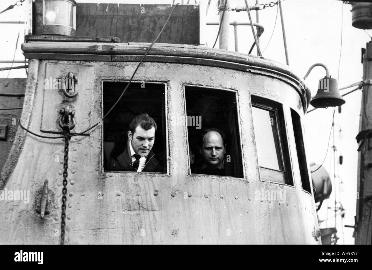11th May 1968: Harry Edom (left) on the bridge of the trawler Ross Antares in which he sailed for Icelandic waters yesterday. He was the sole survivor of the ill-fated Ross Cleveland three in February 1968. Stock Photo