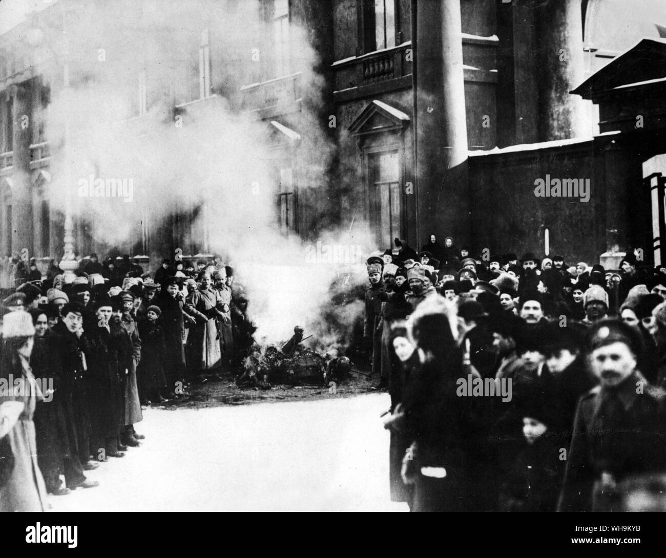 Russian Revolution: Burning the symbols of Tsardom. The first pictures to reach London of the scenes in the streets of Petrograd during the few days which witnessed the fall of the old regime. Imperial signs from the Winter Palaceare thrown into a bonfire. Stock Photo