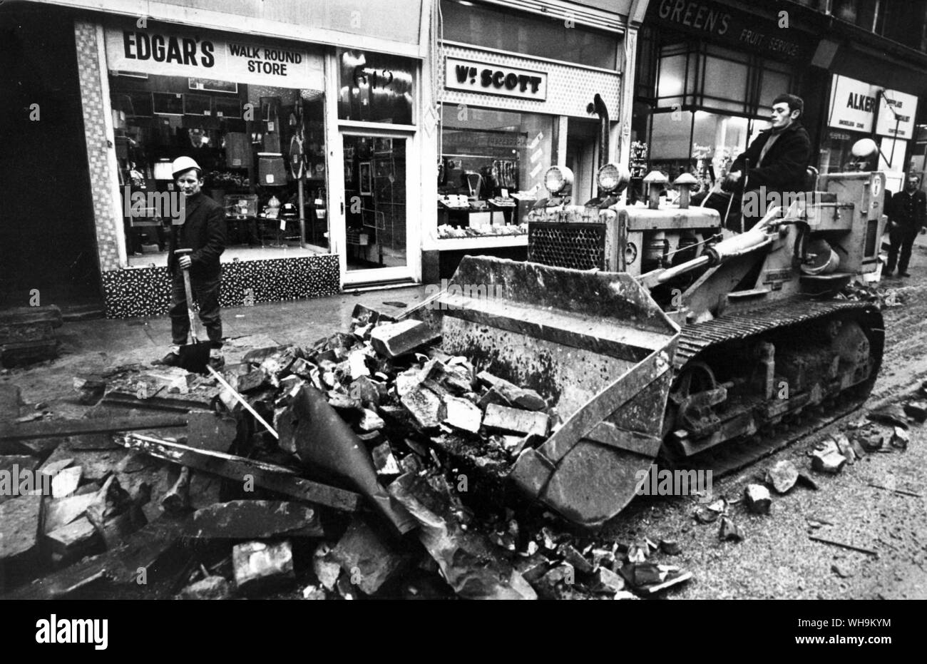 15th January 1968: Glasgow Gale Damage. O.P.S. workmen clear the roadway of rubble from collapsed buildings after the town had been hit by Hurricane Low Q. Stock Photo