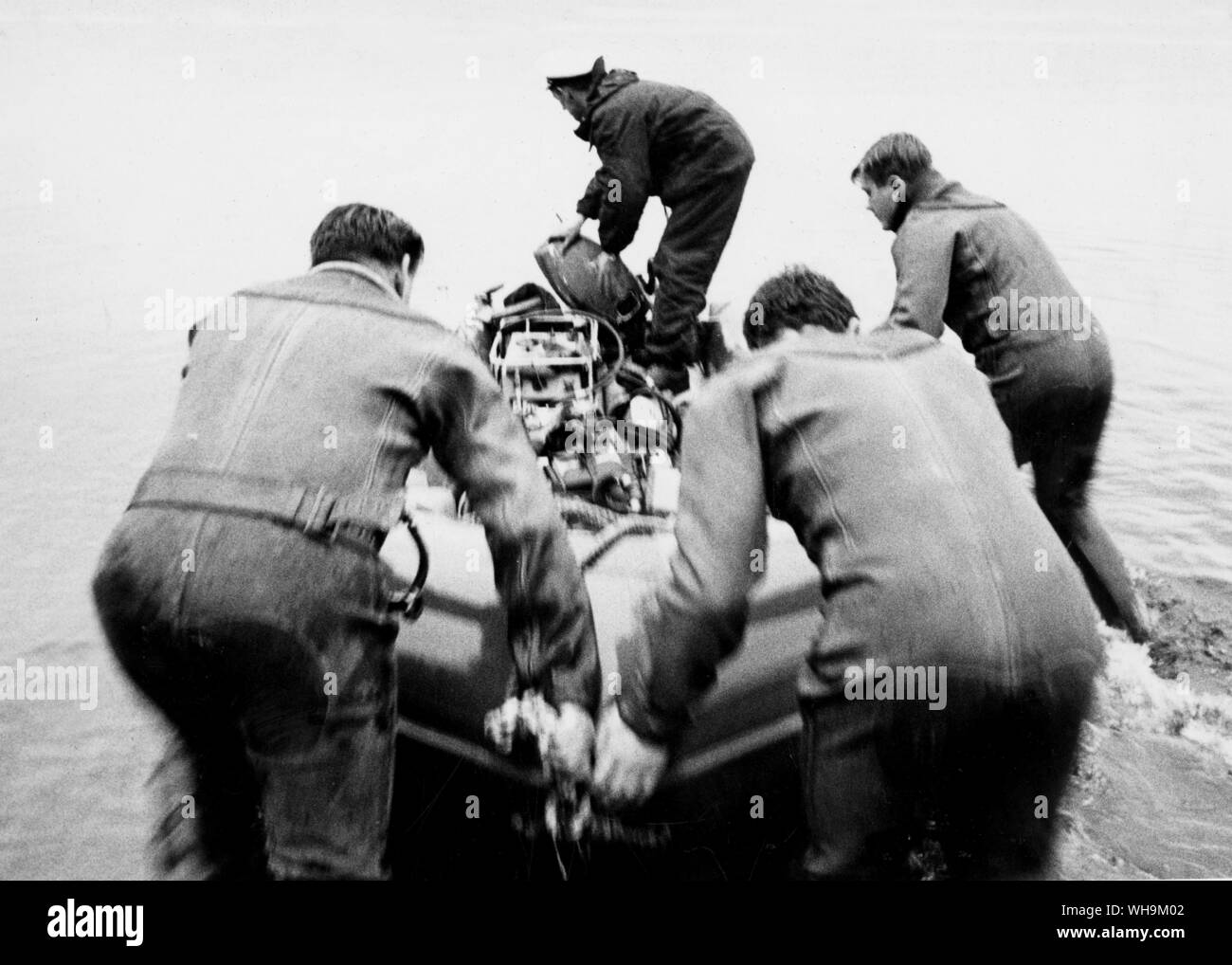 4th January 1967: Donald Campbell is killed in his Blue Bird speed baot. Men go in search for his body. Stock Photo