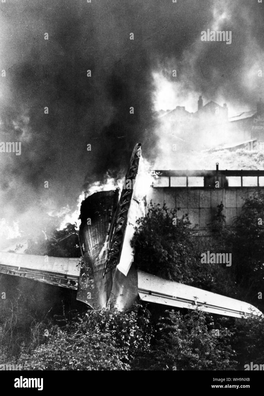4th June 1967: Air crash. The tail end of the machine blazes at Stockport . Stock Photo